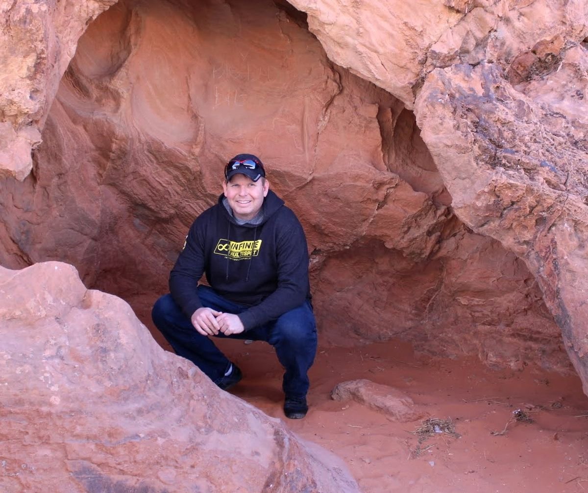 Matt in the red rock country, wearing a multisport hoodie